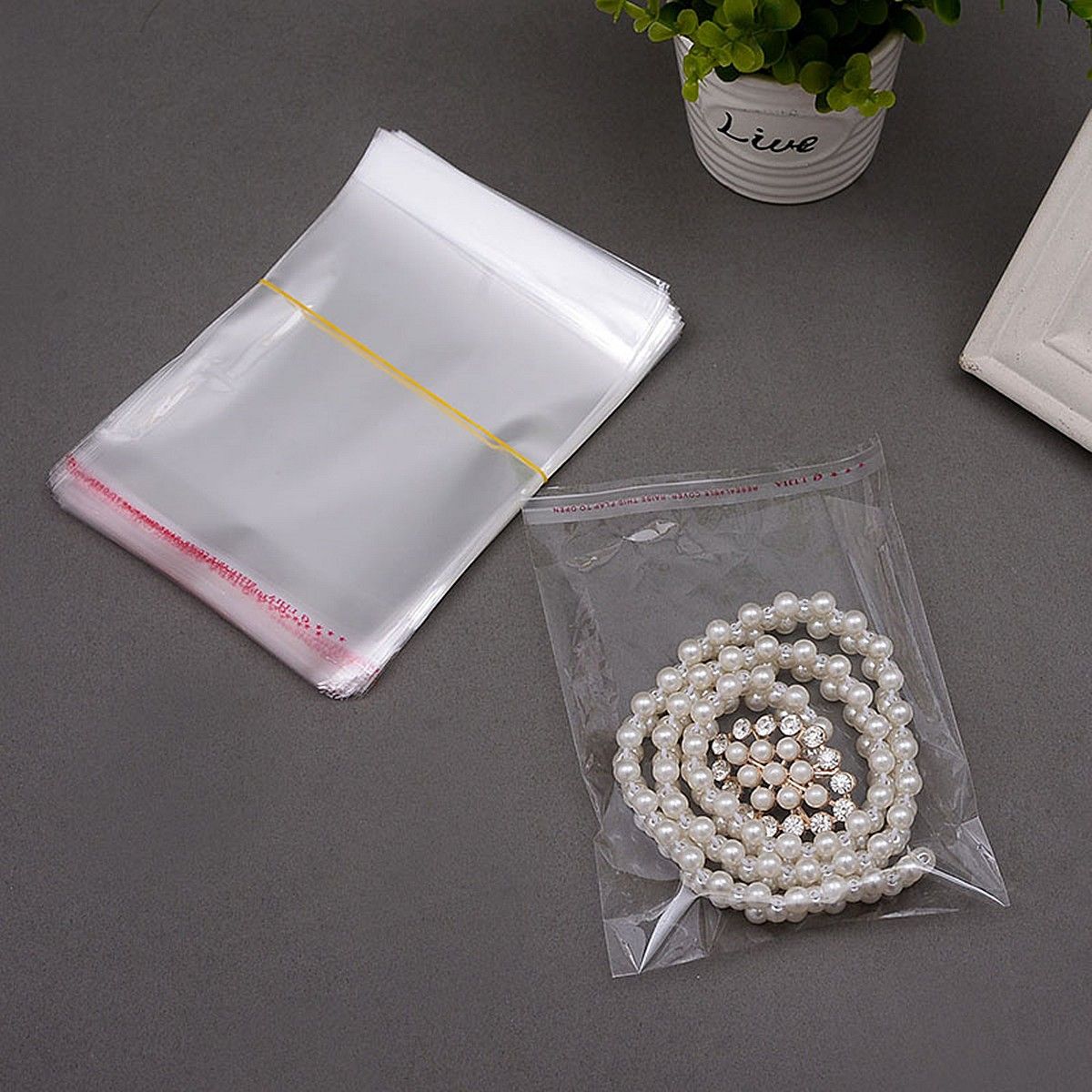 100pcs-12times16cm-Clear-Cellophane-Display-Bags-Self-Adhesive-Seal-Plastic--For-Card-1039191